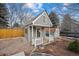 Gray guest house with white trim and small deck at 7636 S Eaton Way, Littleton, CO 80128