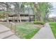 Exterior shot of the building with a grassy lawn and mature trees at 5300 E Cherry Creek South Dr # 804, Denver, CO 80246