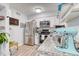 Bright kitchen features stainless steel appliances, gray granite countertops, and modern white cabinetry at 5300 E Cherry Creek South Dr # 804, Denver, CO 80246