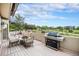 Outdoor deck area featuring a grill and scenic views of the surrounding landscape at 5855 Saddle Creek Trl, Parker, CO 80134