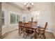 Charming dining room with a view into the kitchen and ample natural light at 5855 Saddle Creek Trl, Parker, CO 80134