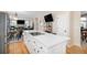 Bright kitchen with a large island and open floor plan at 5855 Saddle Creek Trl, Parker, CO 80134