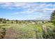 Expansive view overlooking open space with white fencing and scattered homes at 5855 Saddle Creek Trl, Parker, CO 80134