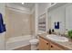 Bathroom with a combined bathtub and shower and a vanity at 612 Blue Teal Dr, Castle Rock, CO 80104