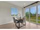Cozy breakfast nook featuring a dining table set, large sliding glass doors, and natural light at 612 Blue Teal Dr, Castle Rock, CO 80104