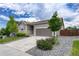 Charming single-Gathering home featuring a manicured front yard and neutral gray siding at 612 Blue Teal Dr, Castle Rock, CO 80104