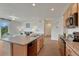 Modern kitchen showcasing an island, wooden cabinets, stainless steel appliances, and an open floor plan at 612 Blue Teal Dr, Castle Rock, CO 80104