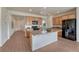 Spacious kitchen features wood cabinets, granite countertops, and modern appliances in an open-concept design at 612 Blue Teal Dr, Castle Rock, CO 80104