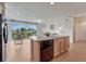 Bright and airy kitchen open to the breakfast nook featuring a center island and stainless steel appliances at 612 Blue Teal Dr, Castle Rock, CO 80104