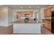 Bright kitchen with center island, wooden cabinets, and modern appliances perfect for cooking and entertaining at 612 Blue Teal Dr, Castle Rock, CO 80104