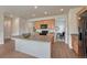 Open kitchen with a center island, wood cabinetry, and stainless steel appliances at 612 Blue Teal Dr, Castle Rock, CO 80104