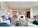 Bright living room featuring modern furnishings, hardwood floors, and an open layout flowing into the kitchen at 612 Blue Teal Dr, Castle Rock, CO 80104
