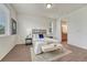 Cozy main bedroom with a plush rug, wood floors, and bright natural light at 612 Blue Teal Dr, Castle Rock, CO 80104