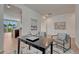 Home office area with artwork, a desk, and view to kitchen and outside at 612 Blue Teal Dr, Castle Rock, CO 80104