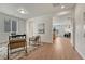 A bright home office with wood floors and a view into the kitchen and living room at 612 Blue Teal Dr, Castle Rock, CO 80104
