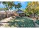 A charming backyard with a bench, patio, and lush green grass at 3336 N Saint Paul St, Denver, CO 80205