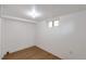 A well-lit basement area with new flooring and a window at 3336 N Saint Paul St, Denver, CO 80205