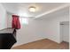 Finished basement space with a small closet and wood-look vinyl flooring at 3336 N Saint Paul St, Denver, CO 80205