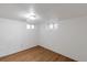 Unfinished basement space featuring two windows and vinyl flooring at 3336 N Saint Paul St, Denver, CO 80205