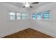 Bright bedroom with hardwood floors and abundant natural light from two large windows at 3336 N Saint Paul St, Denver, CO 80205