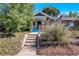 Charming exterior of a brick home with a welcoming front porch and steps at 3336 N Saint Paul St, Denver, CO 80205