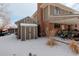 View of the shed and covered patio in the backyard of this charming property at 7835 Nelson St, Arvada, CO 80005