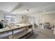 Spacious basement featuring recessed lighting and sewing tables at 7835 Nelson St, Arvada, CO 80005