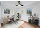 Bright bedroom featuring hardwood floors, a desk, and windows offering ample natural light at 6765 W 33Rd Ave, Wheat Ridge, CO 80033