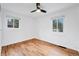 Bright bedroom with hardwood floors, natural light, and a ceiling fan at 6765 W 33Rd Ave, Wheat Ridge, CO 80033