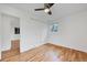Bedroom with hardwood floors, closet, and window providing natural light at 6765 W 33Rd Ave, Wheat Ridge, CO 80033