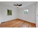 Comfortable bedroom with hardwood floors and two windows providing natural light at 6765 W 33Rd Ave, Wheat Ridge, CO 80033