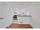 Clean kitchen with white cabinets, breakfast bar with butcher block countertop, and stainless steel appliances at 6765 W 33Rd Ave, Wheat Ridge, CO 80033