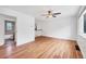 Inviting living room boasts hardwood floors, an open layout, and adjacent access to the bathroom at 6765 W 33Rd Ave, Wheat Ridge, CO 80033