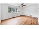 Sun-filled living room with hardwood floors and a large window showcasing the front yard at 6765 W 33Rd Ave, Wheat Ridge, CO 80033