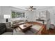 Sunlit living room with hardwood floors and modern decor, perfect for relaxing and entertaining at 6765 W 33Rd Ave, Wheat Ridge, CO 80033