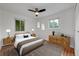 Cozy main bedroom with natural light, hardwood floors, and neutral decor for a serene retreat at 6765 W 33Rd Ave, Wheat Ridge, CO 80033