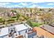 An aerial shot of a rooftop deck with a lounge area, outdoor dining set and nearby neighborhood at 2726 Federal Blvd # 1, Denver, CO 80211