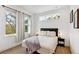 Bright bedroom with large windows and a neutral color scheme at 2726 Federal Blvd # 1, Denver, CO 80211