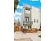 Stylish townhome featuring a private balcony and landscaped front yard at 2726 Federal Blvd # 1, Denver, CO 80211