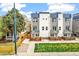 Beautiful townhome with modern facade, private outdoor spaces, and green lawn at 2726 Federal Blvd # 1, Denver, CO 80211