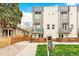 New construction townhome features private balconies, secure fencing, and lush landscaping at 2726 Federal Blvd # 1, Denver, CO 80211