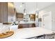 Stylish kitchen featuring a large quartz island and stainless steel appliances at 2726 Federal Blvd # 1, Denver, CO 80211