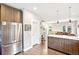 Open concept kitchen with stainless steel refrigerator and convenient access to living areas at 2726 Federal Blvd # 1, Denver, CO 80211