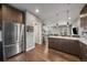 Modern kitchen with stainless steel appliances and island at 2726 Federal Blvd # 1, Denver, CO 80211