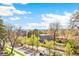 A tranquil neighborhood view of mature trees and sky from an elevated vantage point at 2726 Federal Blvd # 1, Denver, CO 80211