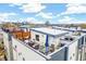 Relax on this rooftop deck with seating and dining space, perfect for entertaining at 2726 Federal Blvd # 1, Denver, CO 80211