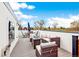 Inviting rooftop deck featuring wicker furniture and a dining set for outdoor entertaining with bright blue sky at 2726 Federal Blvd # 1, Denver, CO 80211