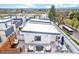 Aerial view of multiple rooftop decks, complete with seating areas, grilling, and views of the city at 2726 Federal Blvd # 1, Denver, CO 80211
