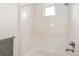 Modern tiled shower with rainfall showerhead and built-in niche at 2726 Federal Blvd # 1, Denver, CO 80211