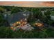 Expansive aerial view of the property with a backyard oasis, fire pit, gazebo, and mature trees at 7472 S Utica St, Littleton, CO 80128